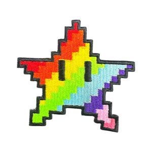 May include: A rainbow-colored pixelated star with a black outline. The star has a pixelated face with two black eyes.