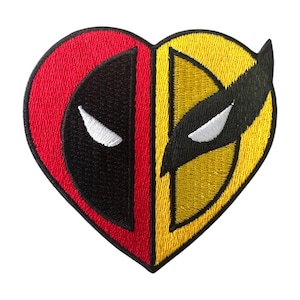 May include: Embroidered patch in the shape of a heart, split into two halves. One half features a red background with a black mask and white eye, the other half has a yellow background with a black mask and white eye. The patch is likely for clothing or accessories.