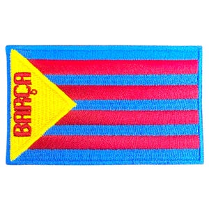 May include: A blue and red embroidered patch with a yellow triangle and the word "BARÇA" in red lettering.