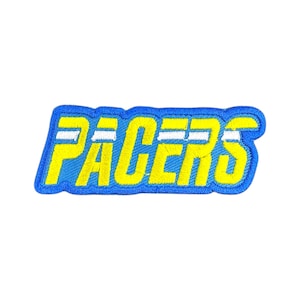 May include: Embroidered patch with the word "PACERS" in yellow, outlined in blue. The patch has a blue background and a white stripe through the center of the letters.