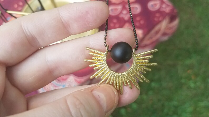 Solar Eclipse Flip Frame Necklace Playthings Studio Matte Onyx