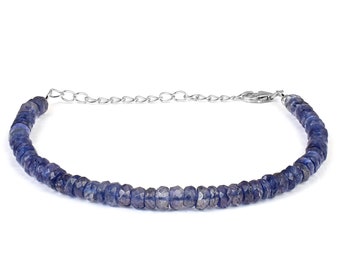 May include: A blue gemstone beaded bracelet with a silver chain clasp.
