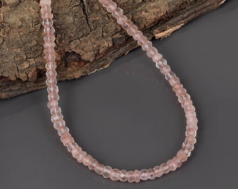 May include: A delicate pink rose quartz necklace with faceted beads. The necklace is made of natural stones and is strung on a clear thread.
