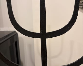 This MCM brutalist style, hand forged 5 arm wrought iron candelabrum, features a distinct tripod base.