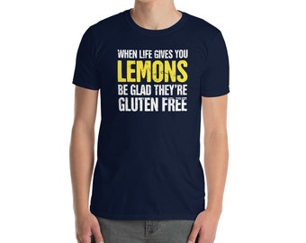May include: A navy blue t-shirt with the text "When life gives you lemons be glad they're gluten free" in white and yellow lettering.