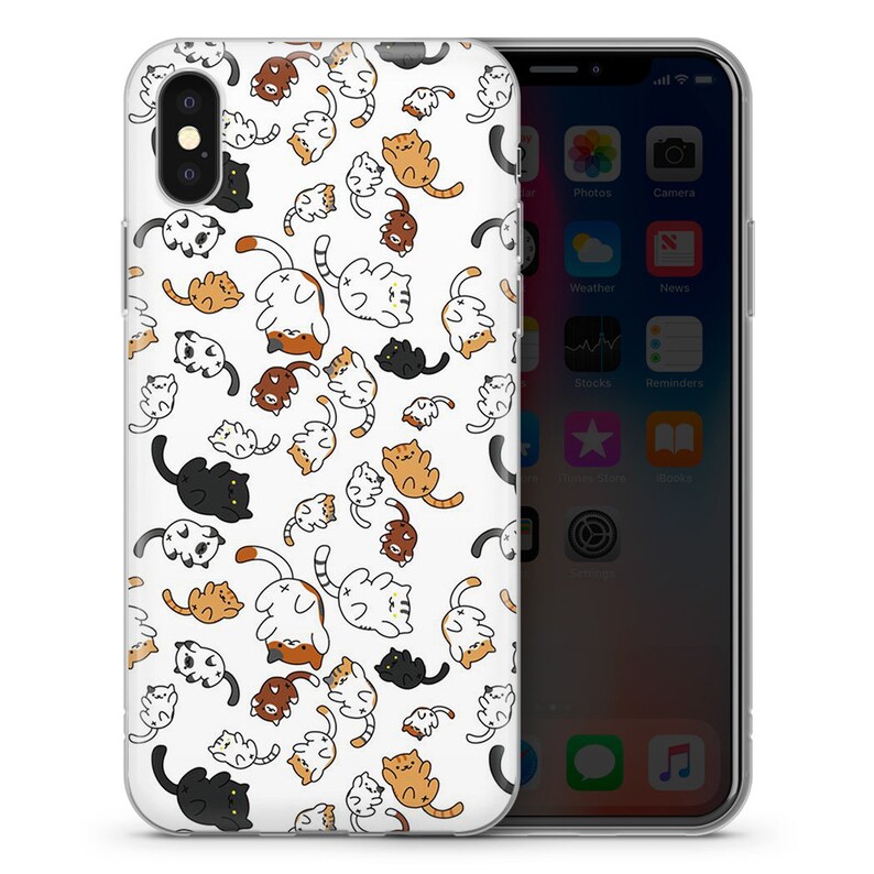 May include: A clear phone case with a white background and a repeating pattern of cartoon cats in various colors, including black, white, orange, and brown.
