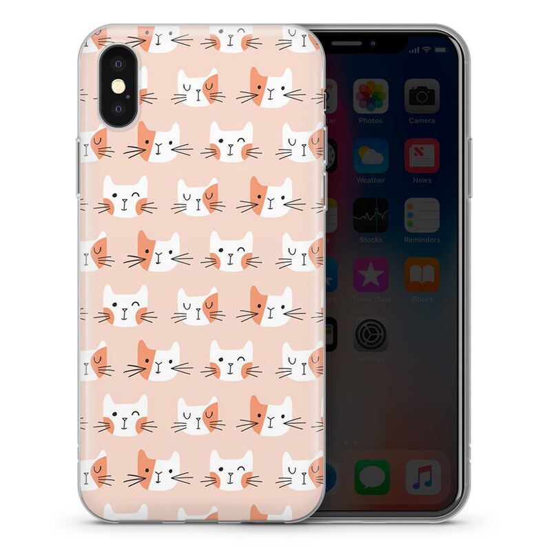 May include: A clear phone case with a pink background and a repeating pattern of white and orange cat faces.
