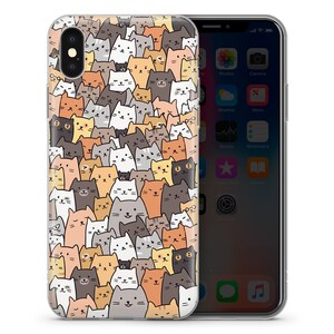 May include: A clear phone case with a pattern of colorful cartoon cats. The case is designed for an iPhone X.