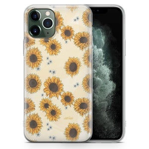 Puede incluir: Una funda transparente para tel&eacute;fono con un patr&oacute;n de girasoles amarillos sobre un fondo crema. La funda est&aacute; dise&ntilde;ada para un iPhone 11 Pro.
