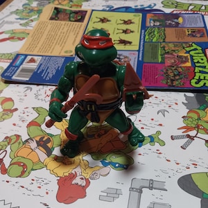TMNT 1988 Michelangelo Action Figure. Incomplete with Card and weapons.