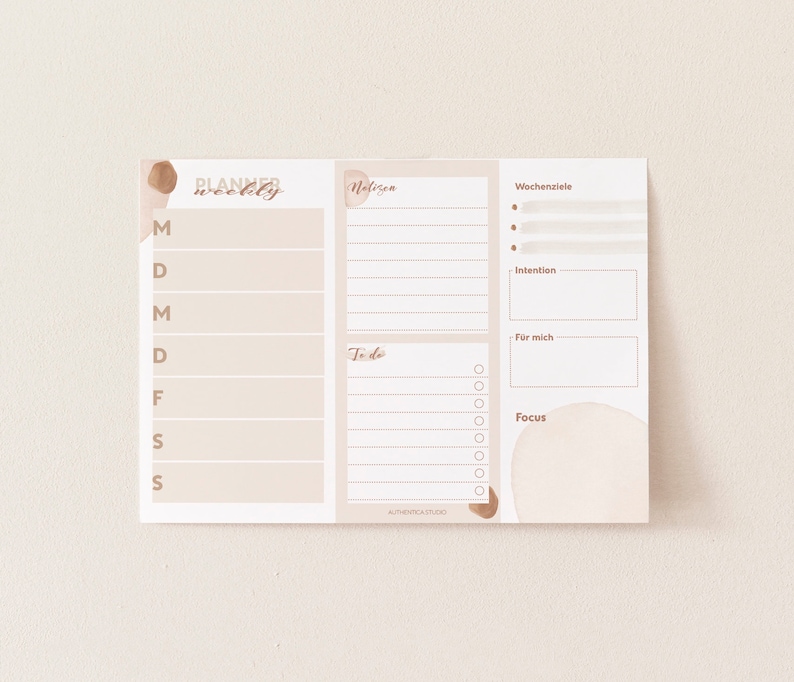 May include: A weekly planner with sections for notes, to-do list, weekly goals, intention, for me, and focus. The planner has a beige background with brown watercolor accents.