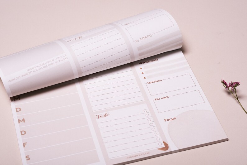 May include: A weekly planner with a beige background and brown text. The planner has sections for daily tasks, to-do lists, weekly goals, intentions, and a focus area. The planner also has a section for "For me".