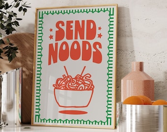 May include: A white framed print with green and gold trim. The print features a red and white illustration of a bowl of noodles with the text "SEND NOODS" in red.