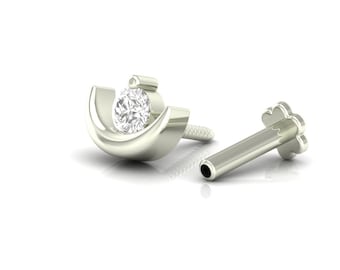 May include: A silver nose stud with a single clear gemstone set in a crescent moon design. The stud is shown with a separate post and back.