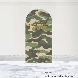 May include: A green and brown camouflage pattern arch backdrop with the text "Happy Birthday Liam" in gold lettering.