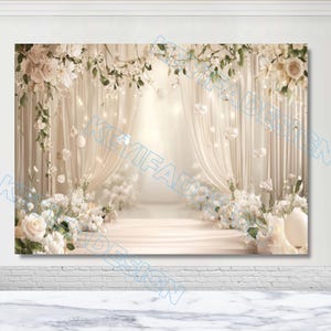 May include: A wedding backdrop with a pathway adorned with white flowers and cream curtains. Floral arrangements and lights hang overhead, creating a romantic atmosphere. The backdrop is set against a white wall, evoking a sense of elegance.