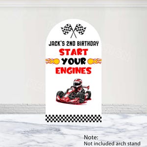 May include: A white archway sign with black checkered trim at the bottom. The sign has a red and yellow graphic of flames and the text "Jack's 2nd Birthday Start Your Engines". A red go-kart with a driver wearing a helmet is in the center of the sign.