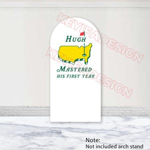 May include: White arch-shaped sign with the text "Hugh Mastered His First Year". The design includes a yellow map of the United States with a red flag. The sign is for a golf-themed event.