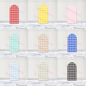 May include: A collection of nine arched fabric covers featuring a checkered gingham pattern in red, yellow, pink, light blue, beige, dark blue, light blue, sage green, and black. Each cover includes the text Note: Not included arch stand.
