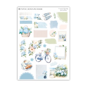 a sticker sheet with blue flowers and a bicycle