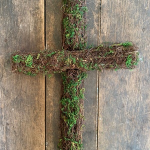 May include: A moss-covered twig cross, perfect for adding a natural touch to your home decor.