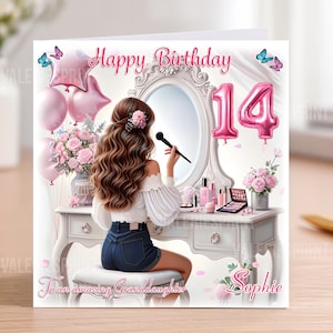 May include: A birthday card featuring a girl at a dressing table, with pink text reading "Happy Birthday" and "14". The card includes pink balloons, flowers, and the text "To an amazing Granddaughter Sophie".