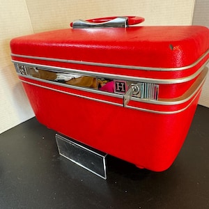 1960s Red  Samsonite “Silhouette” train case with tray, mirror, pouches, and key. About 14” x 7” x 8.5”