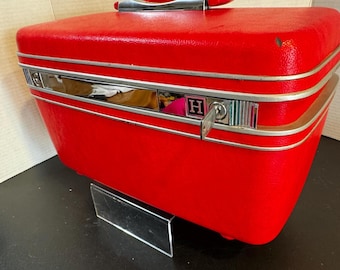 1960s Red  Samsonite “Silhouette” train case with tray, mirror, pouches, and key. About 14” x 7” x 8.5”
