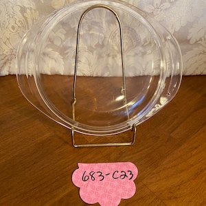 Pyrex lid #683-c23 with tab handles approximately 8”