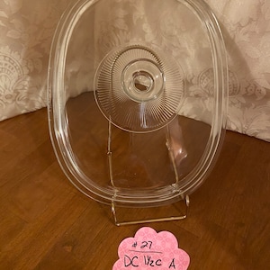 Large Pyrex rectangular lid 11”x 8.5” with knob handle #DC 1 1/2 CA #27, interior flange measurement is 25cm x 19cm w/pattern around handle