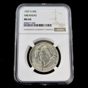 May include: A silver 1937 Arkansas Centennial half dollar coin, graded MS 64, in a protective case. The coin shows profiles of a Native American and a woman, with "ARKANSAS CENTENNIAL" and the dates 1836 and 1936.