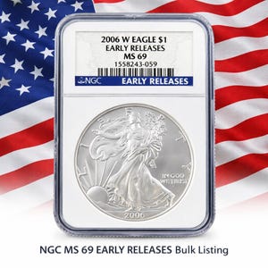 May include: A silver 2006 W Eagle $1 coin, graded MS 69 Early Releases, in a clear protective case. The coin shows Lady Liberty and the inscription "IN GOD WE TRUST". The background features the American flag.