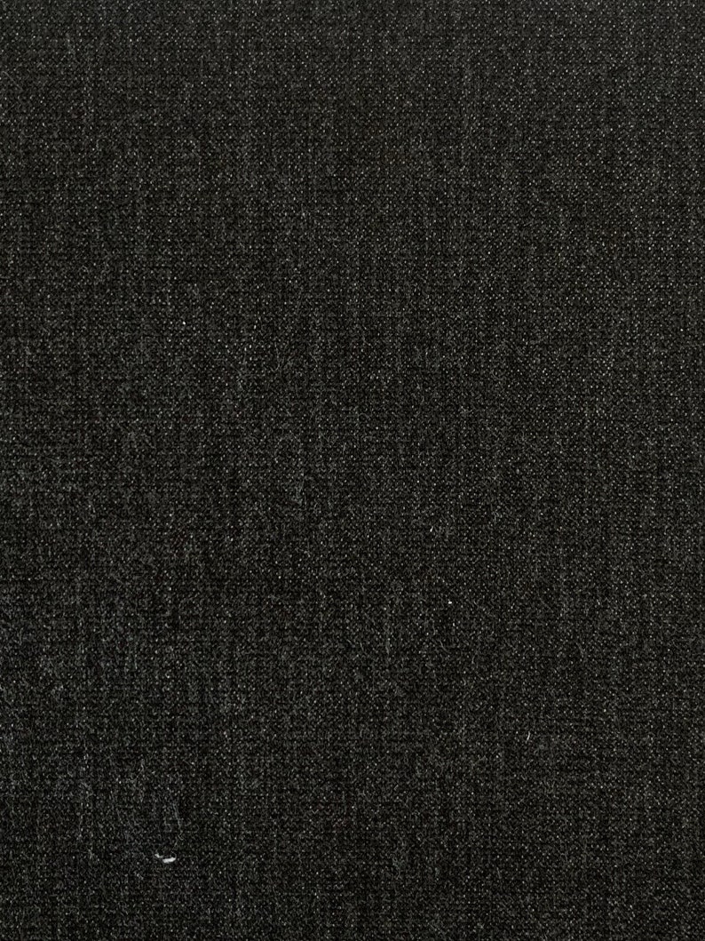 May include: A black textured fabric with a subtle woven pattern.