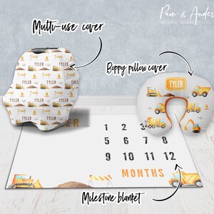 May include: A construction-themed baby milestone blanket with a yellow bulldozer, a stop sign, and numbers 1 through 12. The blanket also includes a matching boppy pillow cover with a yellow bulldozer and the name "Tyler" on a sign.