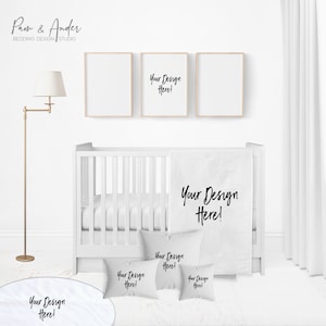 May include: A white cot with a white blanket and pillows featuring the text "Your Design Here!" in black. There are also three framed pictures on the wall behind the cot, one of which also features the text "Your Design Here!" in black.