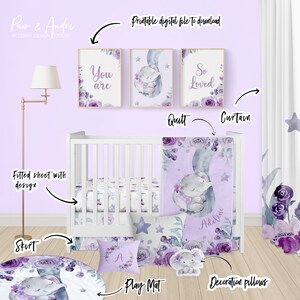 May include: A purple and grey nursery bedding set with a floral design and a sleeping elephant. The set includes a fitted sheet, a quilt, a play mat, and decorative pillows. The quilt and pillows feature the text "You are", "So Loved", and "Adeline".