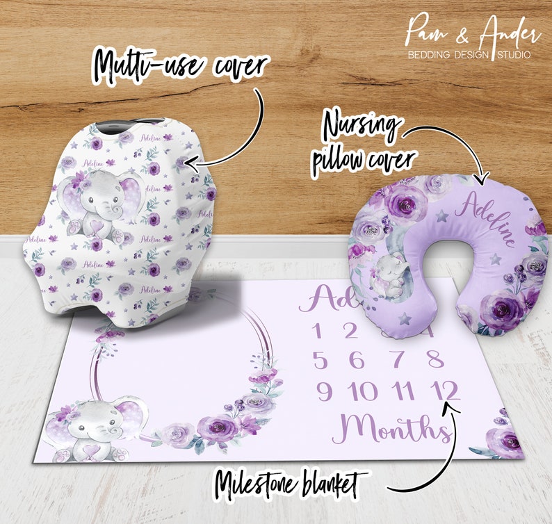 May include: A purple and white milestone blanket with a floral design and a cute elephant illustration. The blanket also includes a number chart for tracking a baby's growth. The set also includes a matching nursing pillow cover and a multi-use cover.