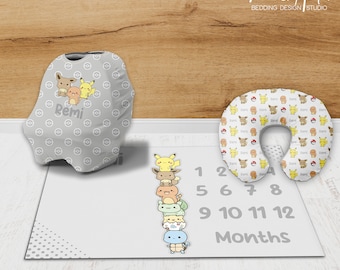 May include: A gray and white baby car seat cover with a Pokemon pattern and the name "Remi" printed on it. A gray and white play mat with a Pokemon pattern and numbers 1-12 printed on it. A white travel pillow with a Pokemon pattern.