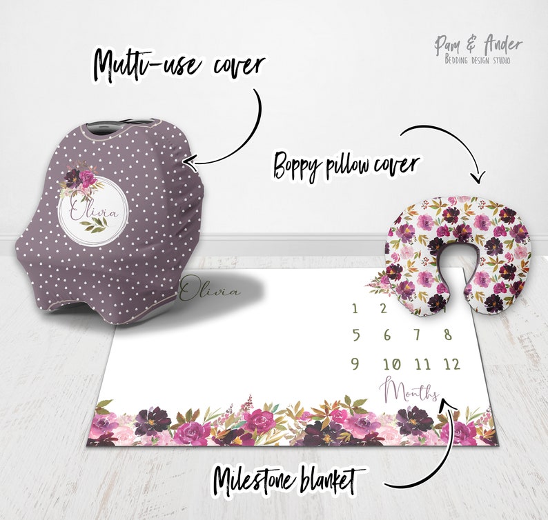 May include: A set of three baby items in a floral pattern with a purple and white colour scheme. The set includes a multi-use cover, a boppy pillow cover, and a milestone blanket. The blanket has numbers 1-12 printed on it to track a baby's growth.
