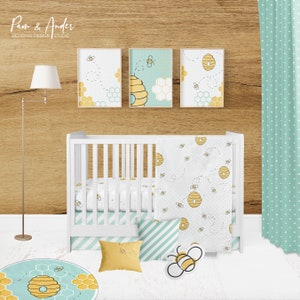 May include: A white crib with a blue and white striped fitted sheet and a white blanket with a beehive and bee pattern. There are three framed pictures above the crib with a beehive and bee pattern. A yellow pillow with a beehive and bee pattern is on the floor in front of the crib. A round rug with a beehive and bee pattern is on the floor. The background is a wood wall with a green curtain with white polka dots.