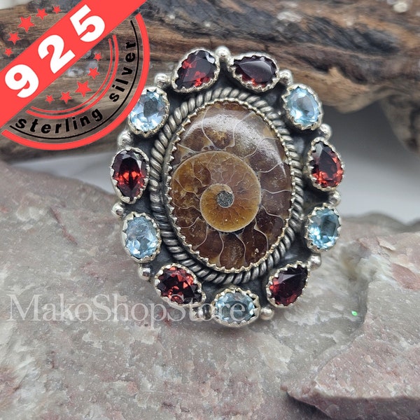 24 carats natural  Canadian Ammonite fossil with Garnet and Topaz sterling silver ring adjustable size 7