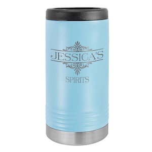 May include: A light blue stainless steel can cooler with a black lid. The cooler is engraved with the text "JESSICA'S SPIRITS" and a decorative design.