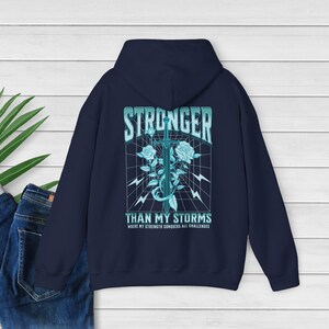 CPTSD Stronger Than My Storm Hoodie Essential Hoodie Hidden Disability Shield of God Hoodie audhd Mentalhealth Hoodie Substance Abuse Shirt