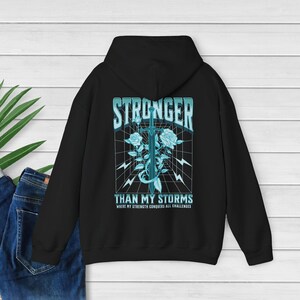 CPTSD Stronger Than My Storm Hoodie Essential Hoodie Hidden Disability Shield of God Hoodie audhd Mentalhealth Hoodie Substance Abuse Shirt