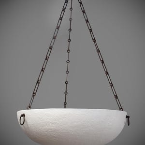 May include: A white, textured bowl-shaped pendant light fixture suspended by dark metal chains. The fixture has a circular mounting plate and a textured surface. The chains are attached to the bowl with small rings.