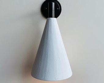Bronze and plaster cone wall light