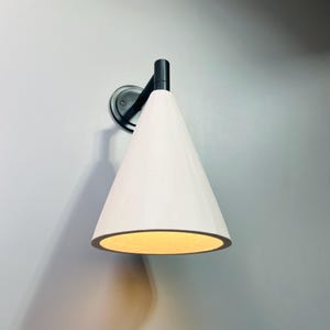 Bronze and plaster cone wall light