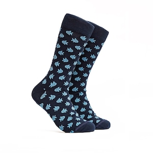 May include: A pair of dark blue socks with a light blue fish pattern.