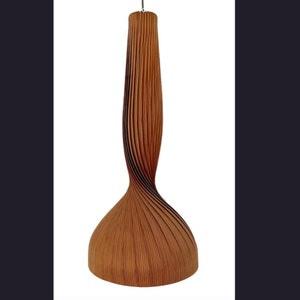 May include: A tall, brown pendant light fixture with a vertically pleated, ribbed texture. The lamp features a narrow, elongated neck that flares out into a wider, rounded base, suspended from a single thin cord at the top center.