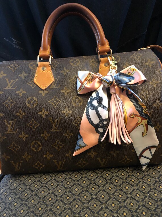 Louis Vuitton Braided Handle With Colorful Leather Charm